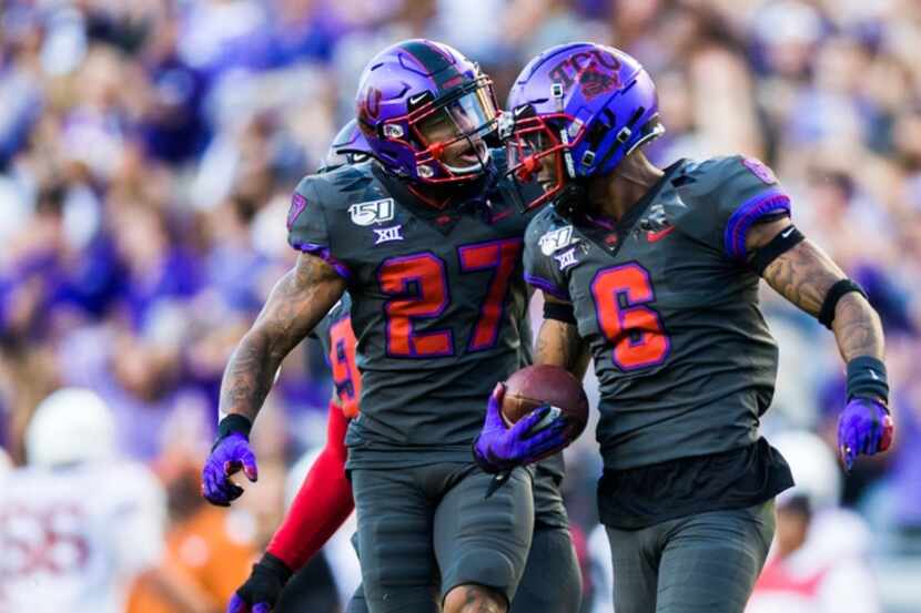 TCU Horned Frogs safety Ar'Darius Washington (27) and safety Innis Gaines (6) celebrate...