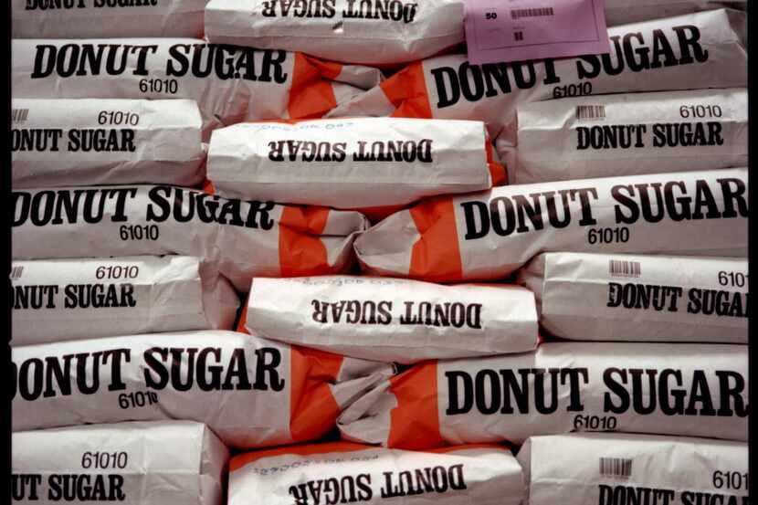 ORG XMIT: S0371433433_STAFF 11-05-01----- 50 pound bags of donut sugar used to make the Mrs...
