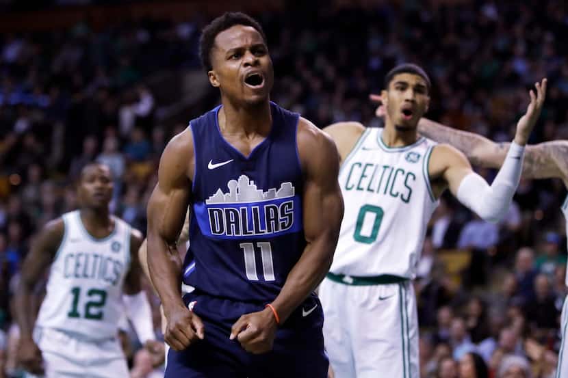 Dallas Mavericks guard Yogi Ferrell reacts after being charged with a foul during the second...
