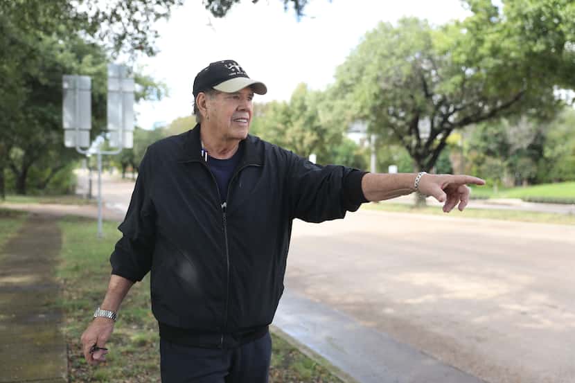 John Mitro points out some of faded lane stipes along Forest Lane near the intersection of...