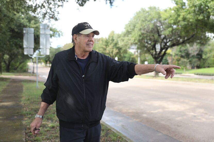 John Mitro points out some of faded lane stipes along Forest Lane near the intersection of...