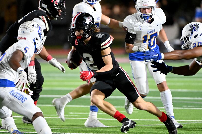 Lovejoy's Jaxson Lavender (2) runs upfield between Frisco's Arron Jamison-Johnson (6) and...