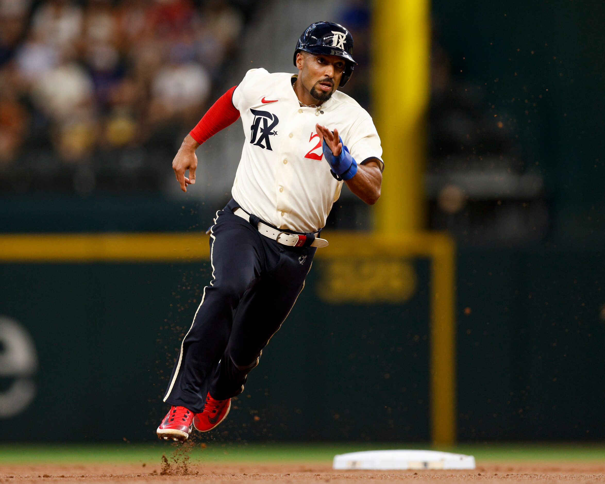 Texas Rangers second baseman Marcus Semien (2) rounds second base on a single by shortstop...