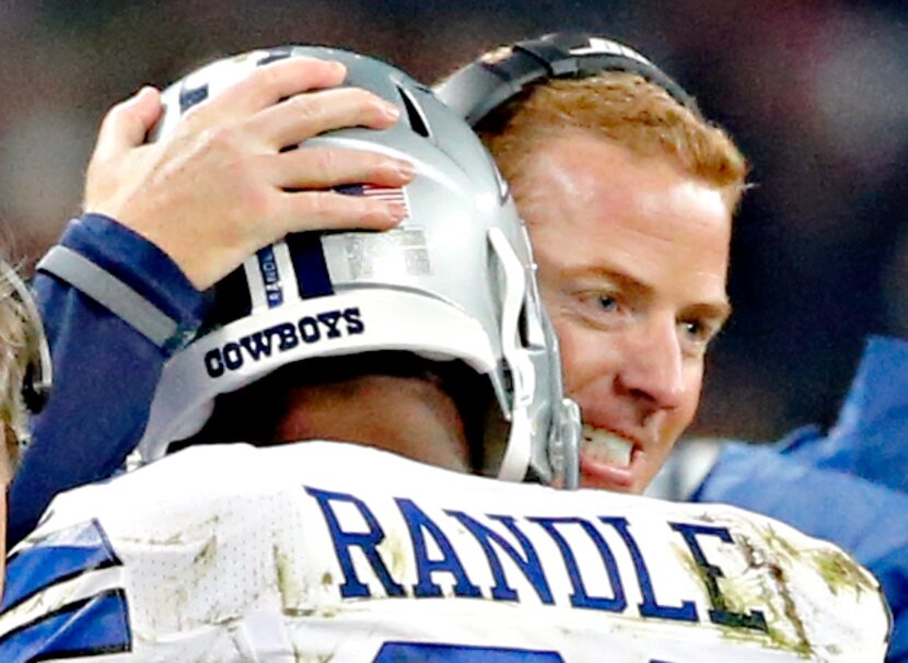 Dallas Cowboys head coach Jason Garrett (right) congratulates running back Joseph Randle on...