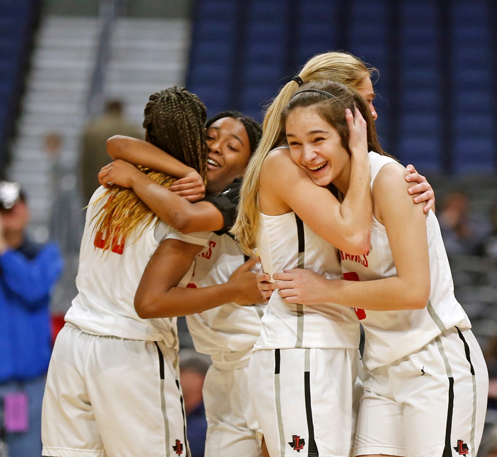 Frisco Liberty guard Jezelle Jolie Moreno #0 receives hug from Frisco Liberty guard Lily...