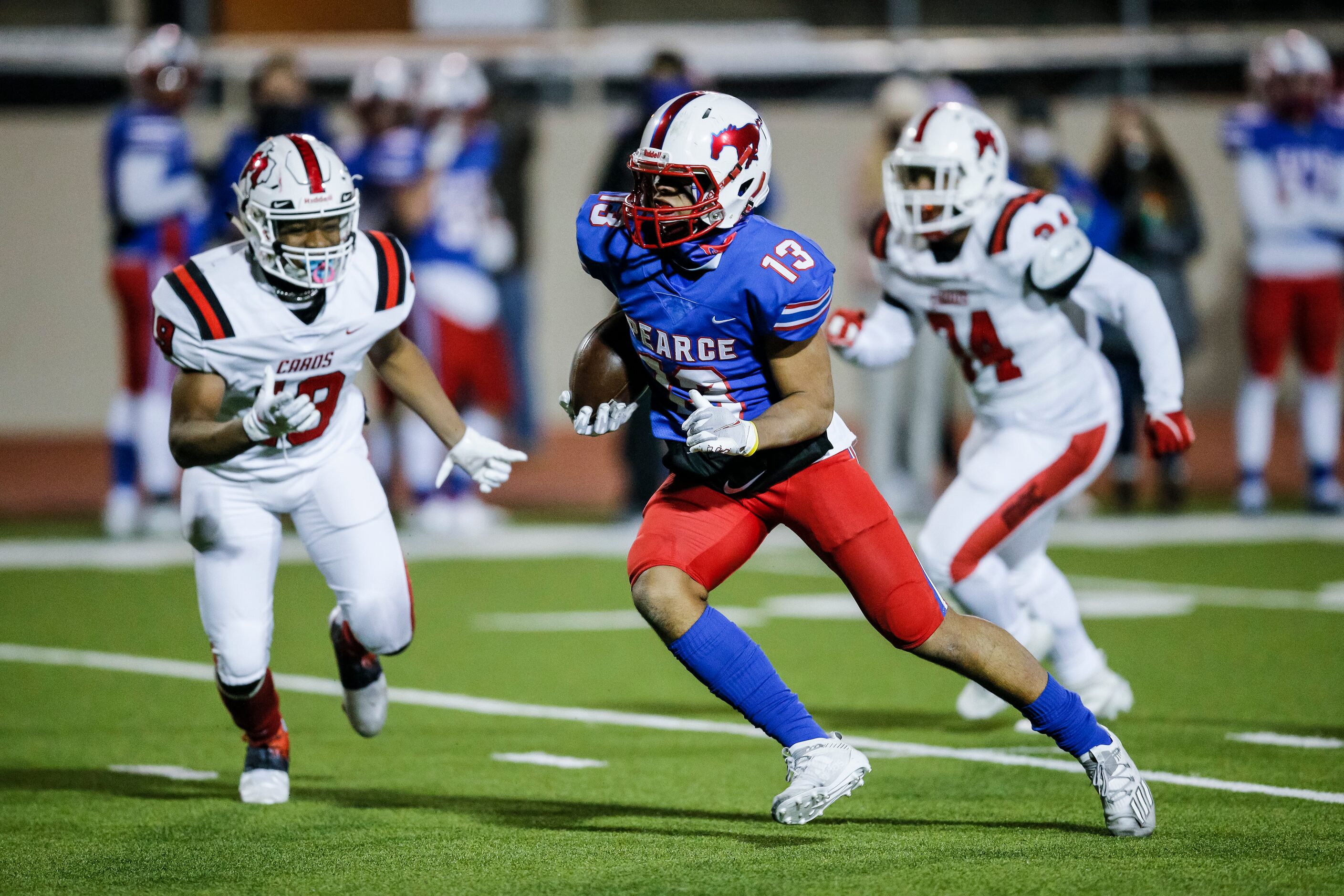 JJ Pearce junior wide receiver Oliver Crawford (13) carries the ball during the first half...