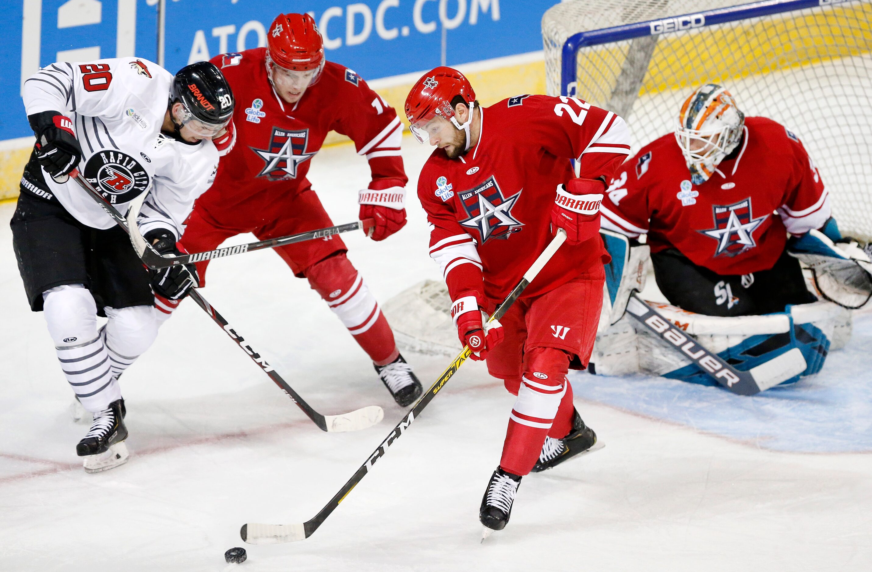 Allen Americans forward Tyler Sheehy (22) clears the puck from Rapid City Rush forward...