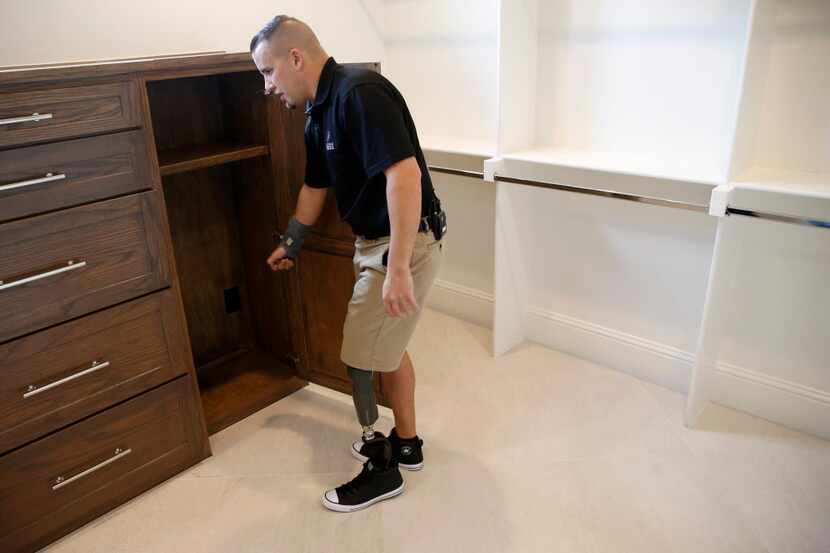 Retired U.S. Air Force Sr. Airman Brandon Byers shows where he will charge and keep his leg...