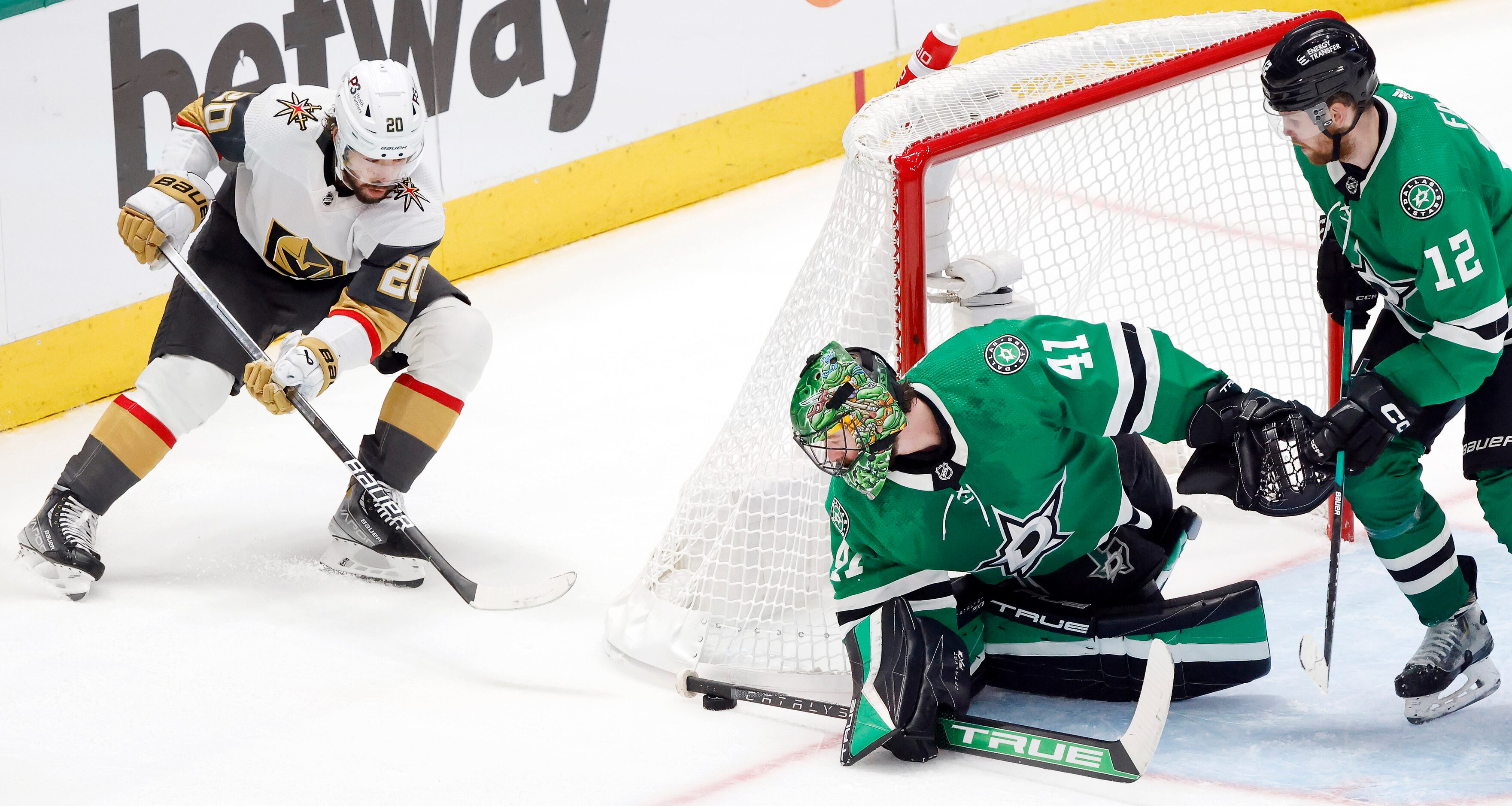 Dallas Stars goaltender Scott Wedgewood (41) reaches around for the puck as Vegas Golden...