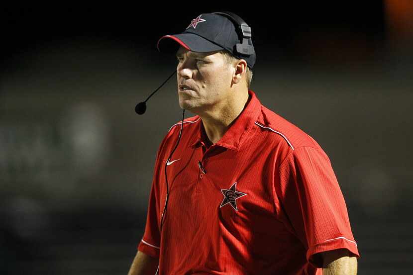 Coppell head coach Joe McBride strides up and down the sidelines against Southlake Carroll...