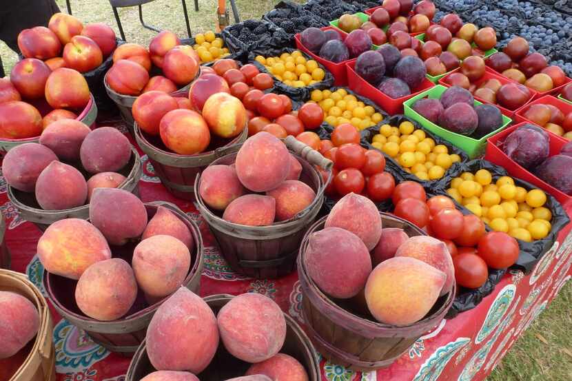 Brothers Rowdy and Roger Heddin each have a spot at Firewheel farmers market, where peaches...