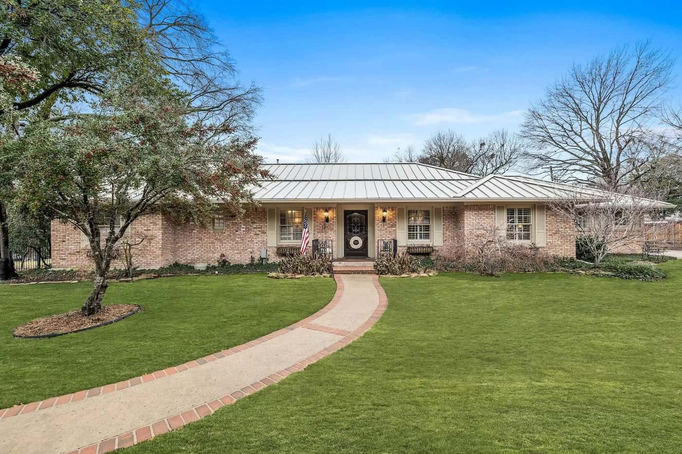 Home exterior with blush and white brick.