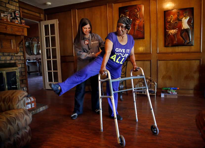 Top 100  Encompass Health and Hospice physical therapist Bridgette McConnell (left) works...