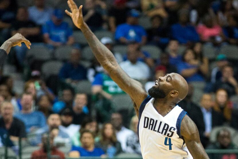 Dallas Mavericks forward Quincy Acy defends a Charlotte Hornets shot during the first half...