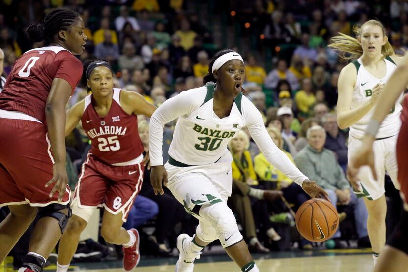 Baylor guard Alexis Jones (30) dribbles during the first half of an NCAA college basketball...