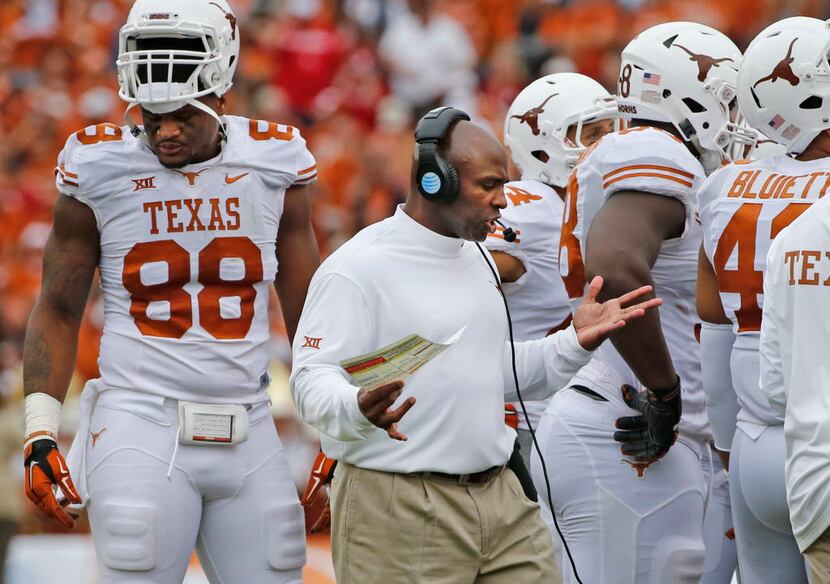 Texas head coach Charlie Strong patrols the sidelines  during the Oklahoma University...