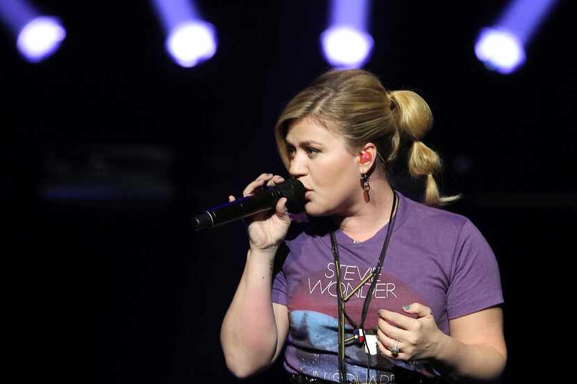 Kelly Clarkson performs during the Opportunity Education Foundation benefit concert at...