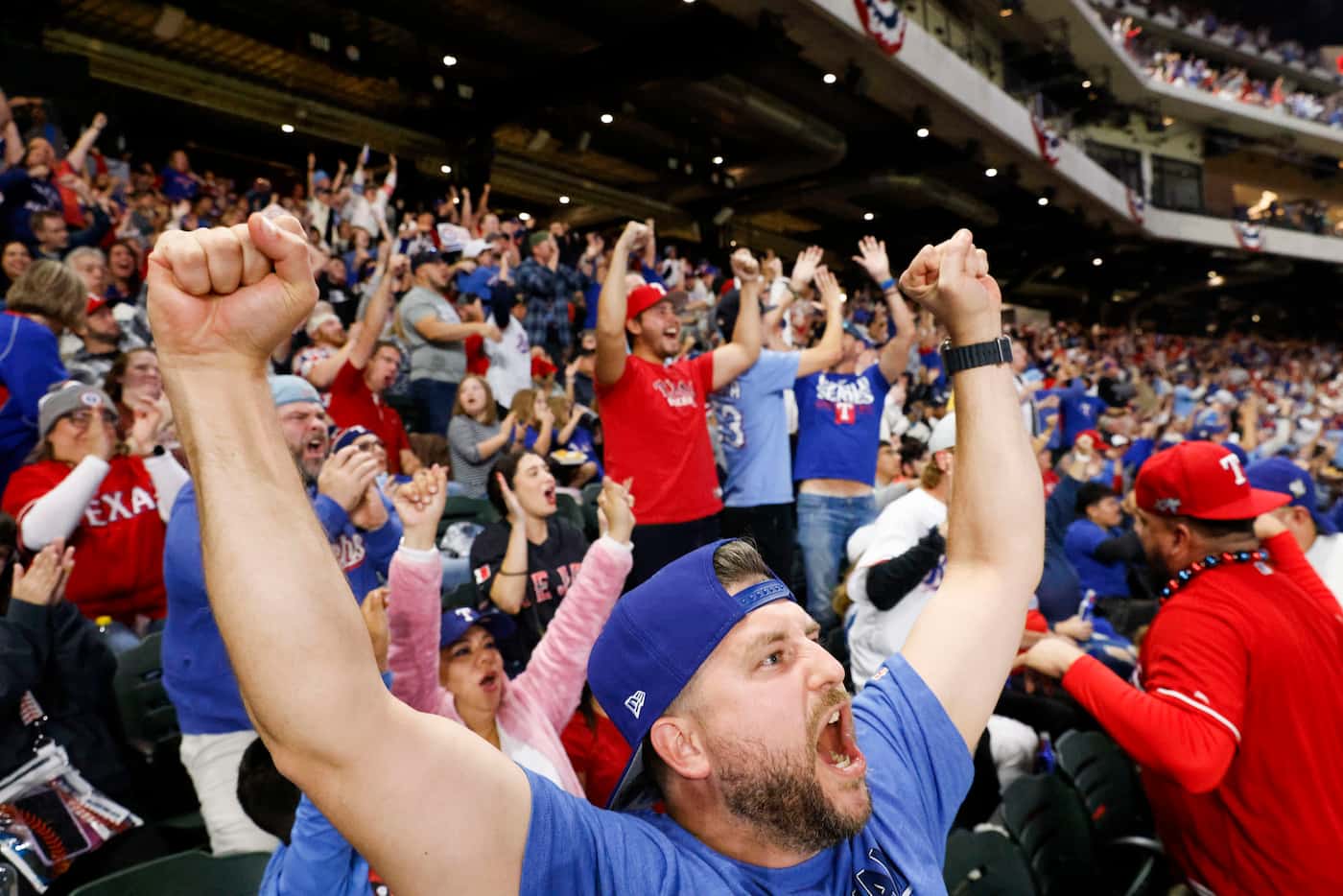 Brandon Moosberg including other Texas Rangers fan celebrate during the end of sixth inning...