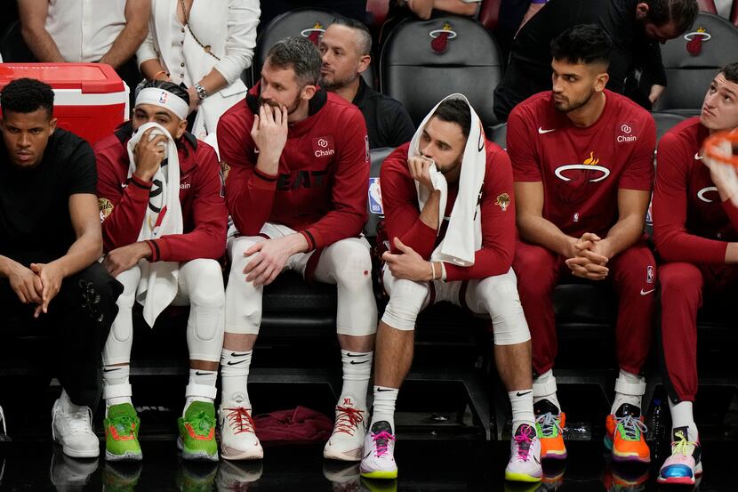 Miami Heat players sit on the bench at the end of Game 4 of the basketball NBA Finals...