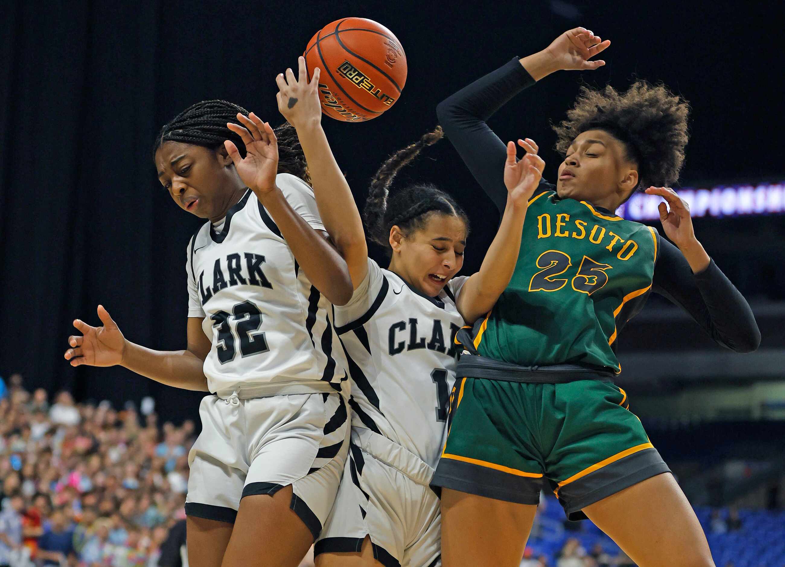 Desoto Amayah Garcia (25) battles Clark Cougars’ Natalie Huff (1) and Clark Cougars’ Kaitlin...