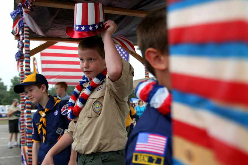 Cub Scouts of Pack 287 from Shephard Elementary, wait for the Plano Independence Parade to...