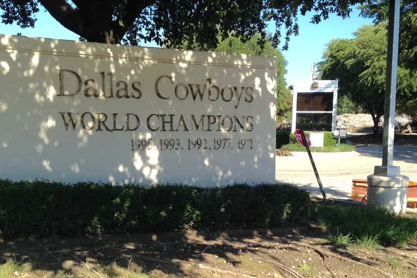 The old entryway to the former Dallas Cowboys headquarters in Irving still brags about past...