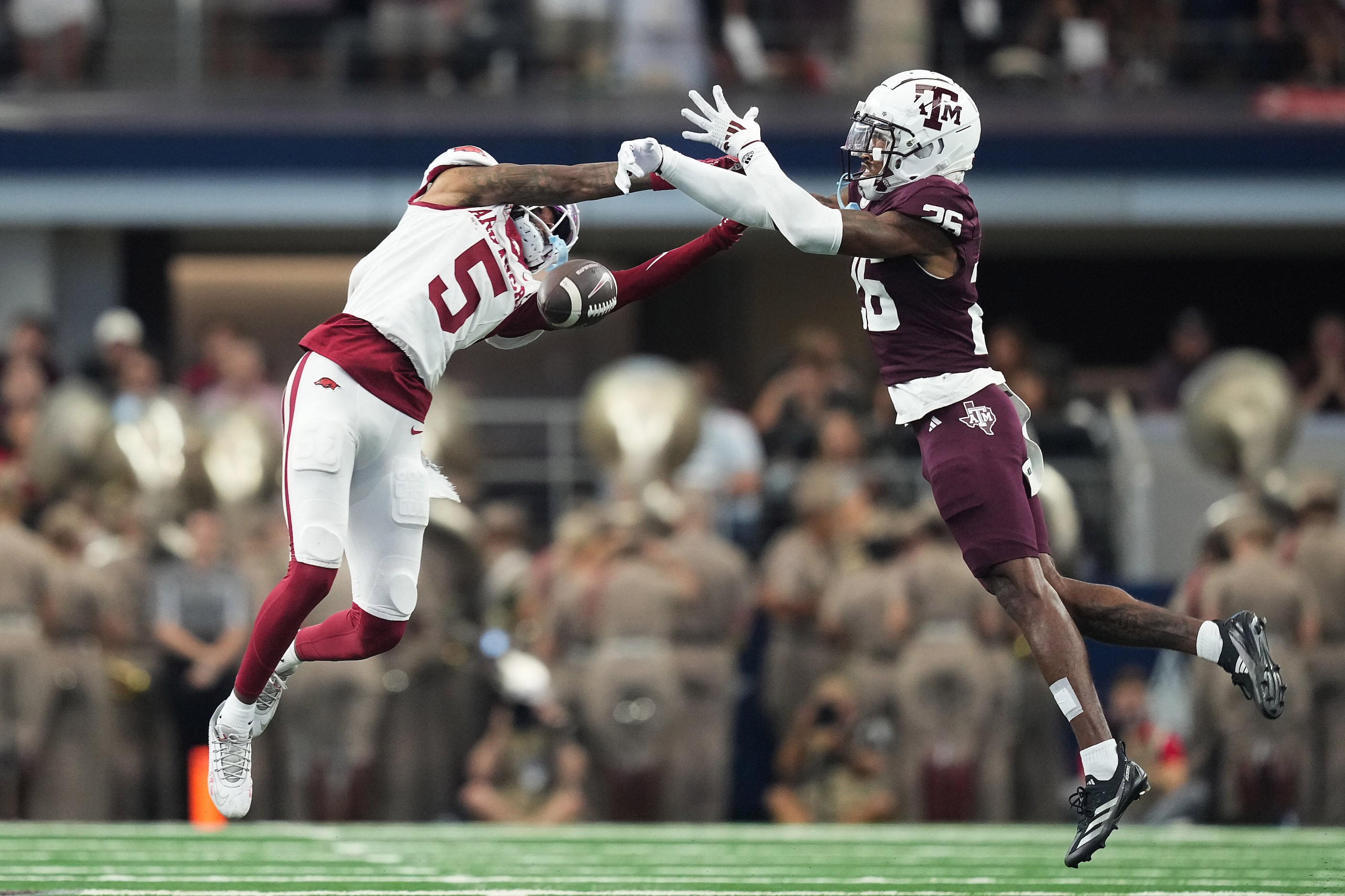 Texas A&M defensive back Will Lee III (26) breaks up a pass intended for Arkansas wide...