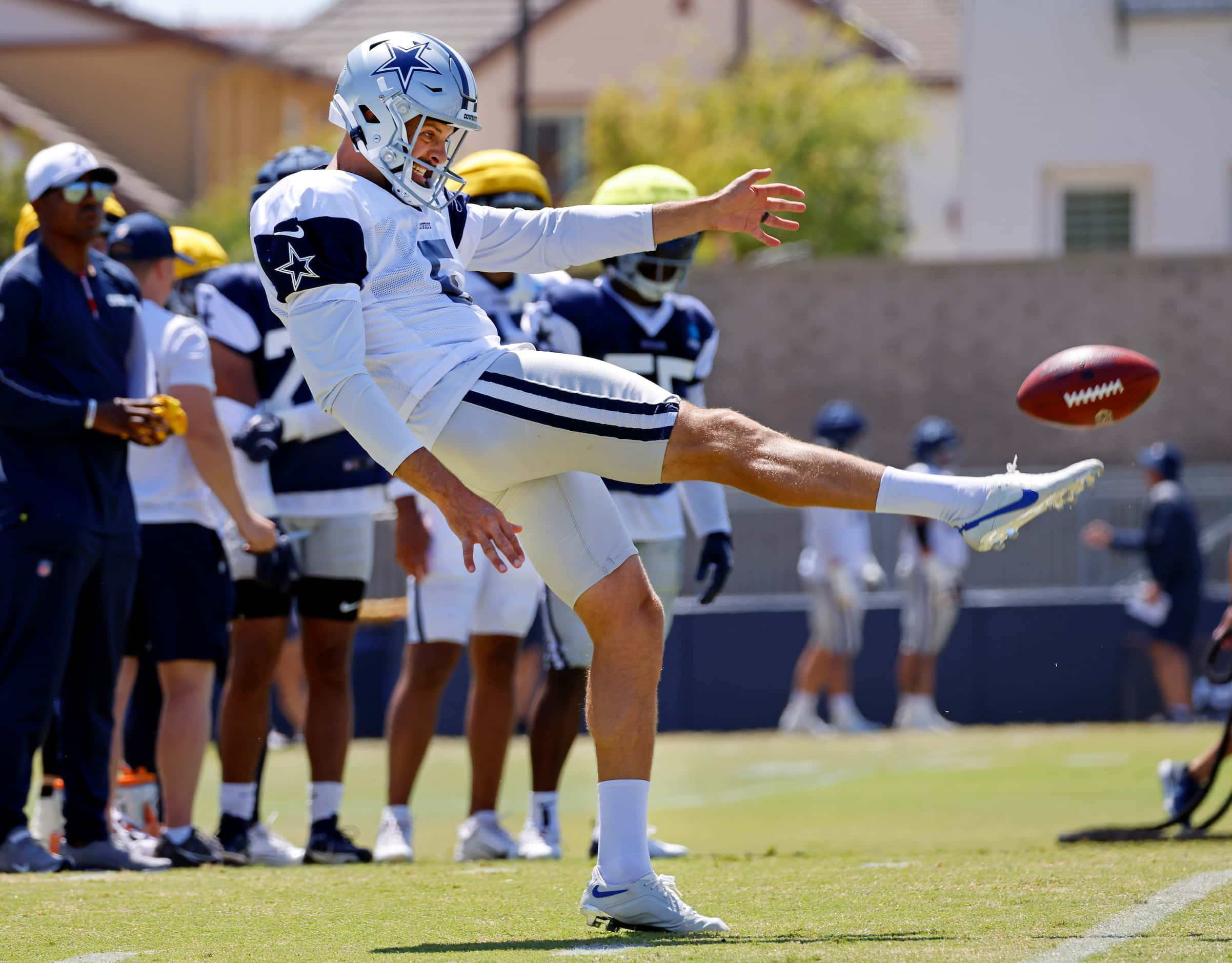 Dallas Cowboys punter Bryan Anger (5) kicks the ball during special teams plays at training...