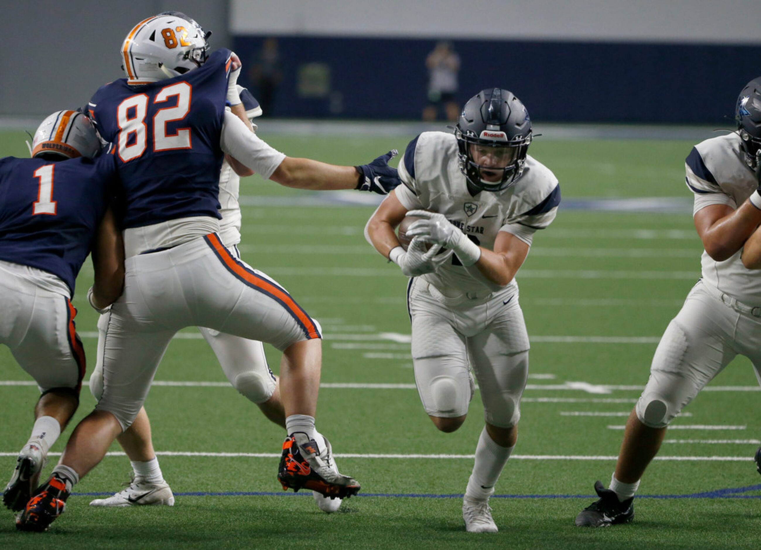 Frisco Lone Star's Jake Bogdon (2) scores a touchdown as Frisco Wakeland's Preston Snean...