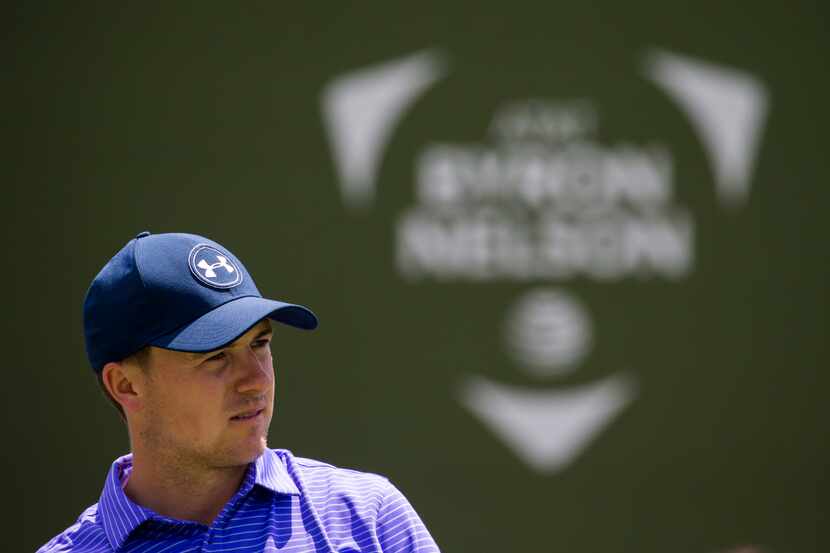 Professional golfer Jordan Spieth watches his ball after he tees off at the seventeenth hole...