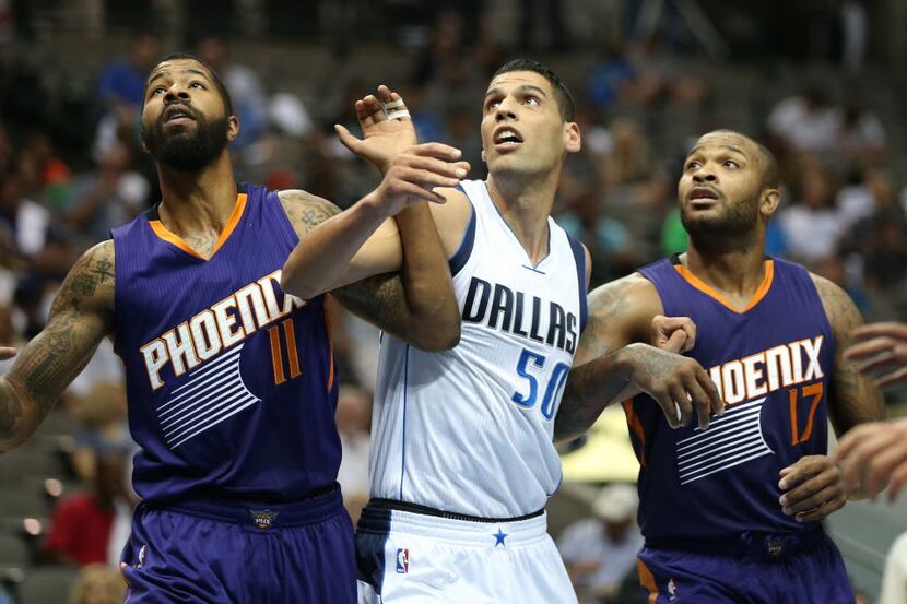 Dallas Mavericks center Salah Mejri (50), Phoenix Suns forward Markieff Morris (11) and...