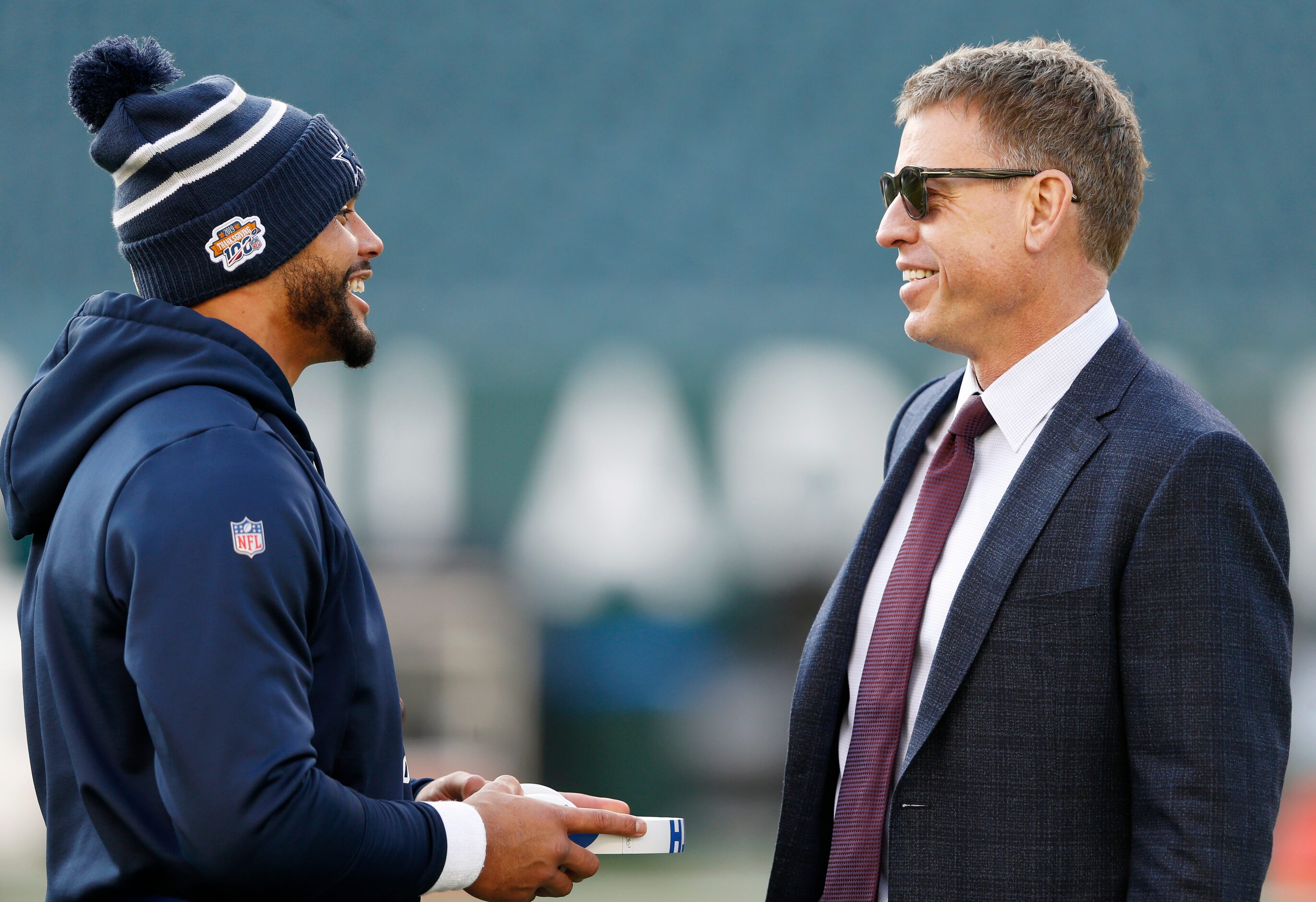 Dallas Cowboys quarterback Dak Prescott (4) talks with former Dallas Cowboys quarterback...