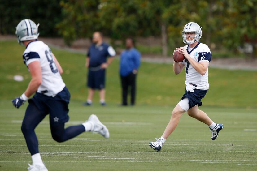 Dallas Cowboys quarterback Cooper Rush (7) looks to pass in a drill during rookie minicamp...