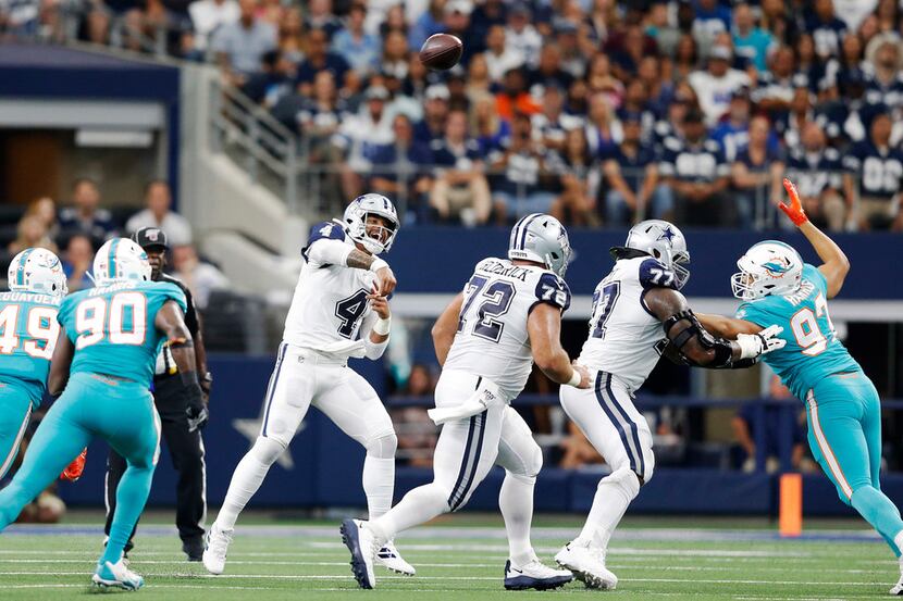 Dallas Cowboys quarterback Dak Prescott (4) attempts a pass in a game against the Miami...