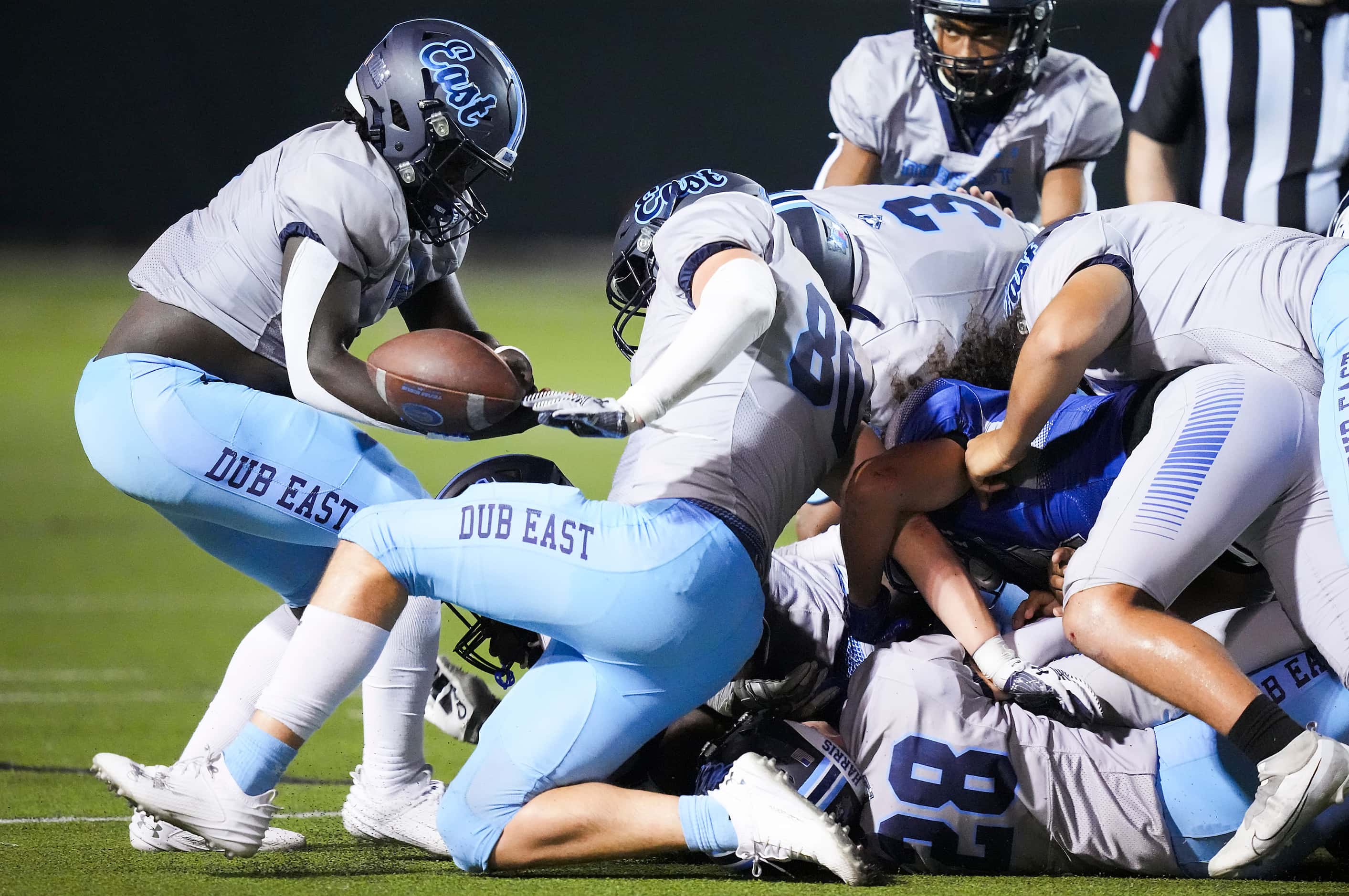 Wylie East running back Keve'yon Thorne (left) recovers a fumble by Grand Prairie running...