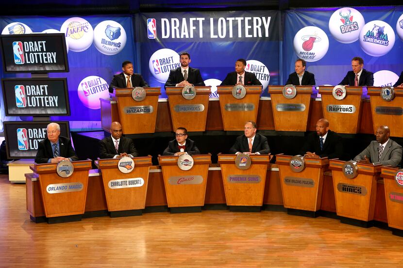 NBA team representatives sit onstage at the start of the NBA draft lottery. The Mavericks'...