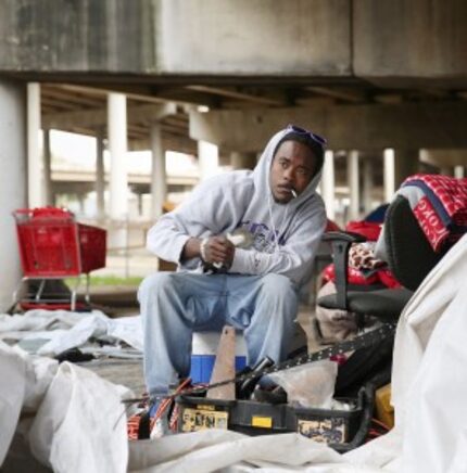  Wyken Masters, 29, looks up while sitting near his tent at "Tent City." (Andy Jacobsohn/The...