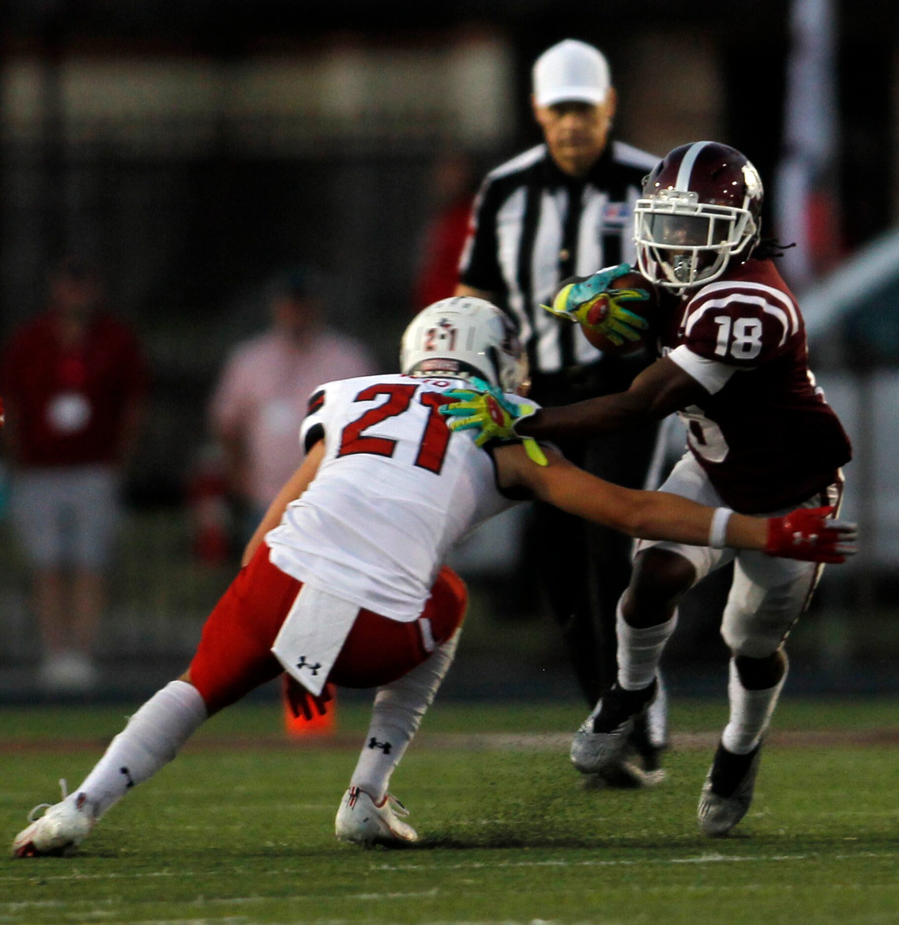 Red Oak running back Cyrus Moore (18) is tackled by Rockwall Heath defensive back Bryson...