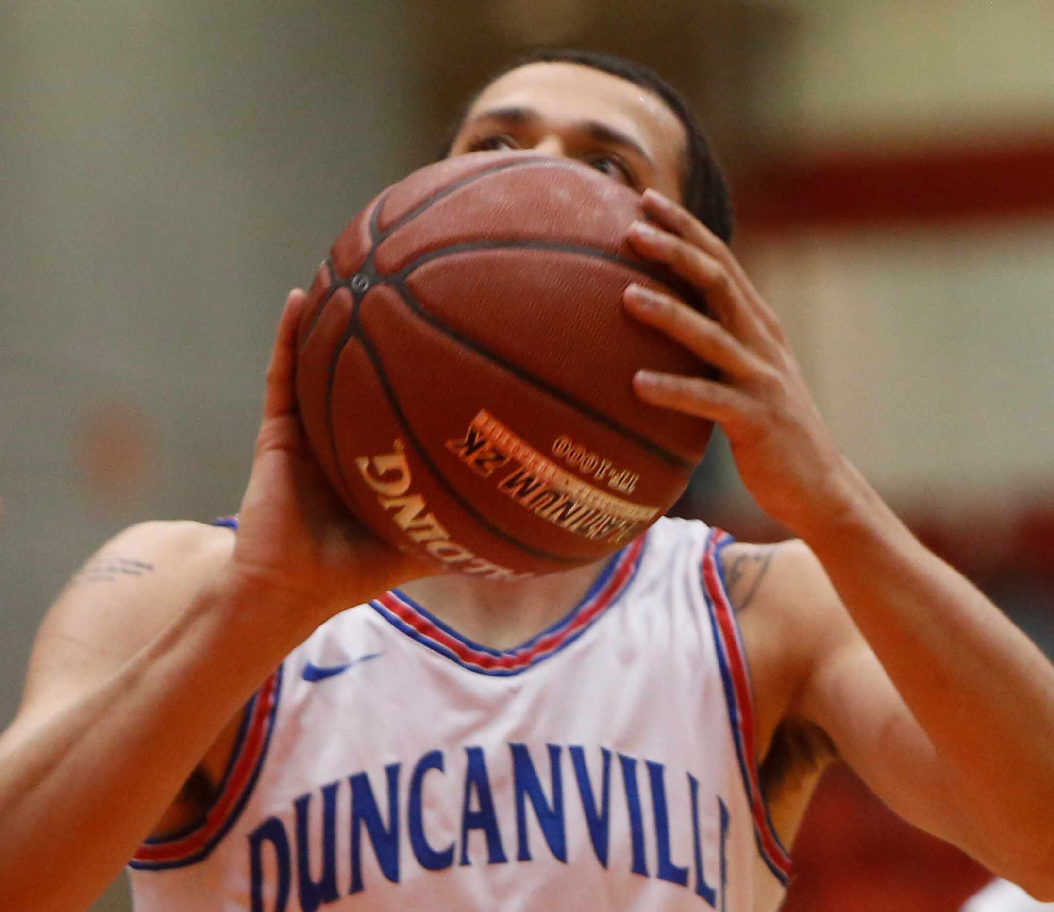 Duncanville forward Robert Banks (14) focuses before sinking a free throw during first half...