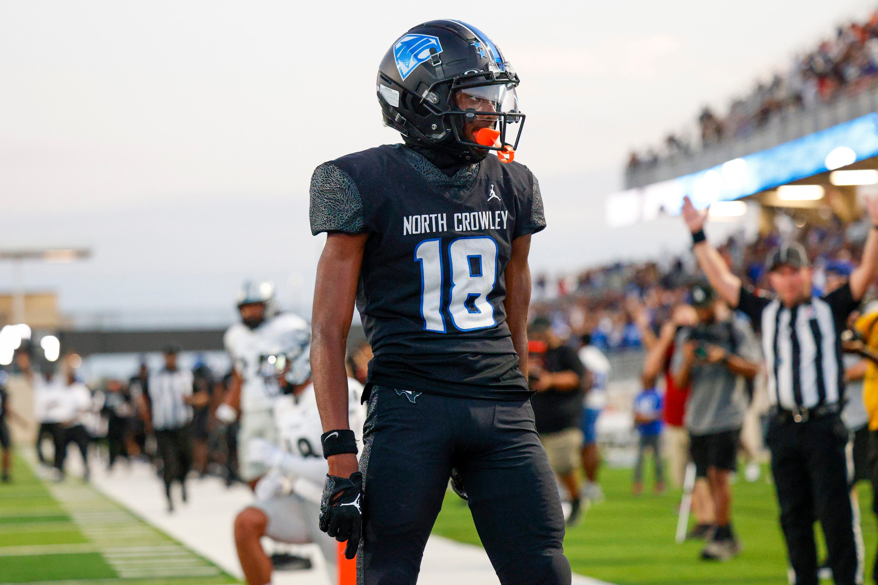 North Crowley wide receiver Jaidan Brooks (18) reacts after scoring a touchdown during the...