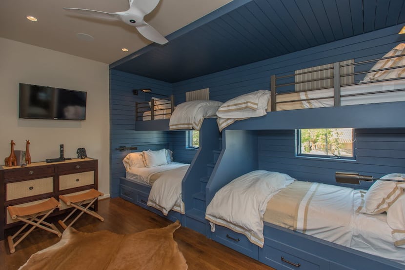 Twin bunk beds constructed by Mark Hoesterey have drawers underneath for storage, built-in...