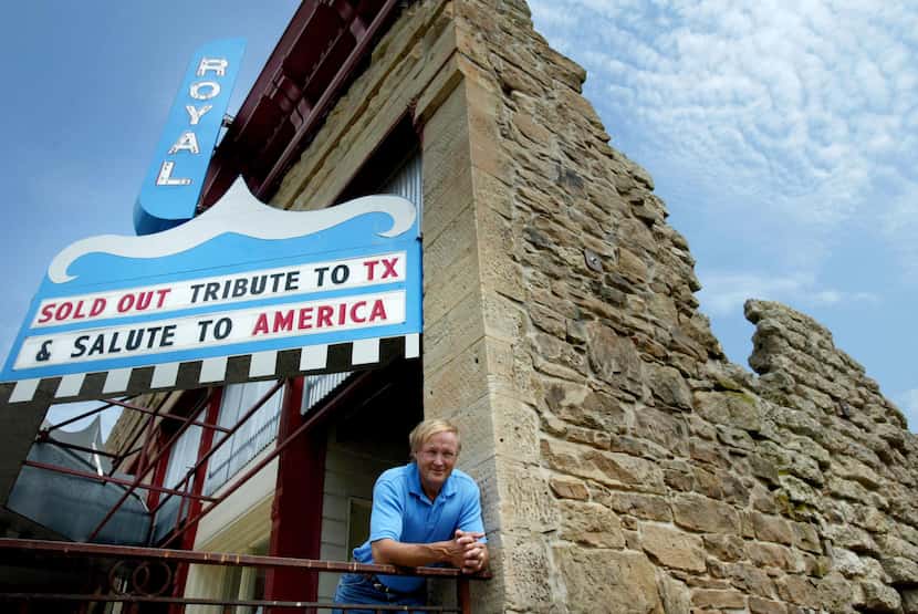 George Getschow, posing in the burned-out shell of Archer City's Royal Theater in 2005, says...
