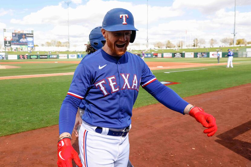 Texas Rangers Clint Frazier celebrates his second inning home run in a spring training game...