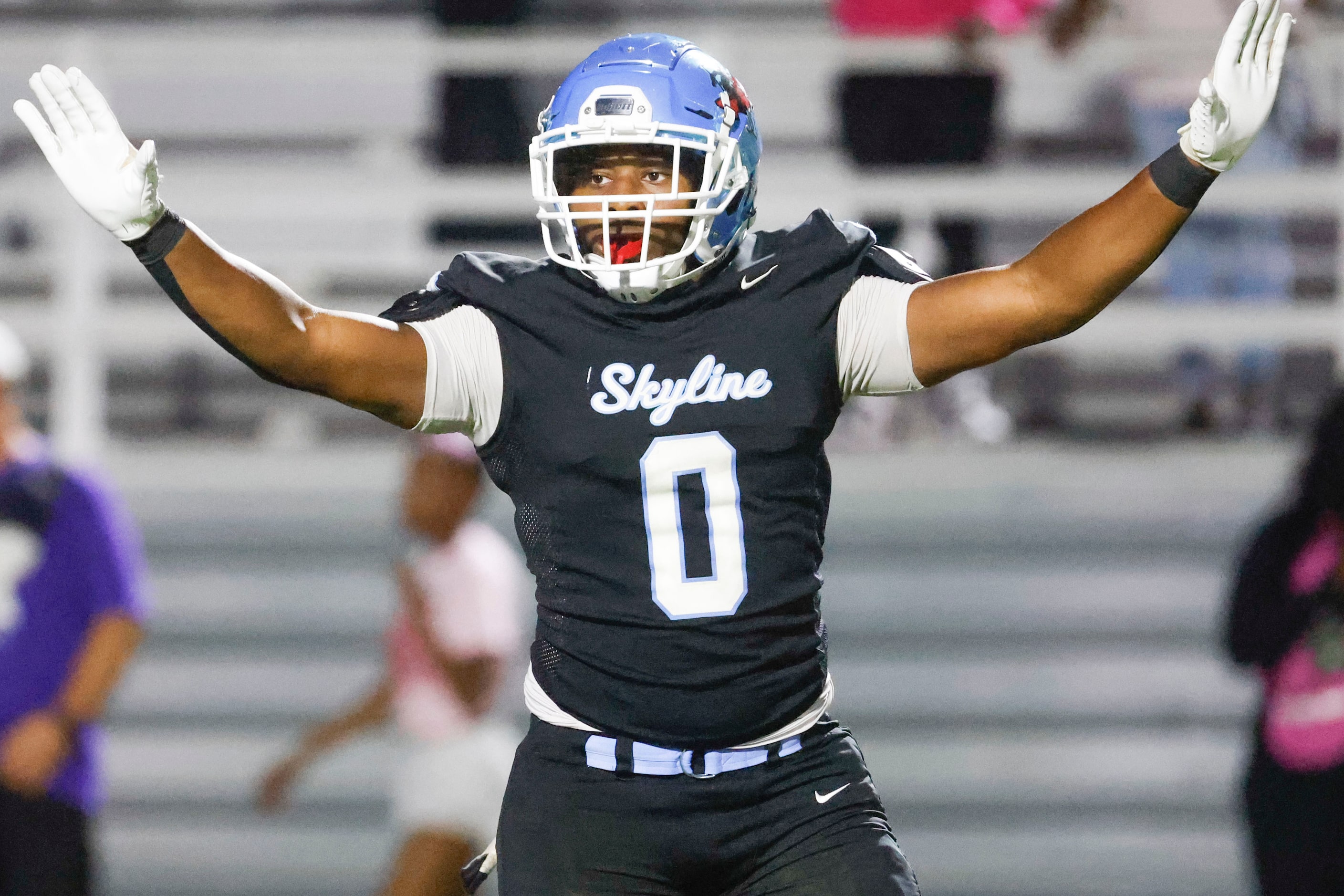 Skyline High’s Elijah Barnes gestures to the bench during the second half of a football game...