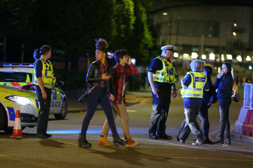 Police and fans are shown at the scene outside Manchester Arena on Monday. 