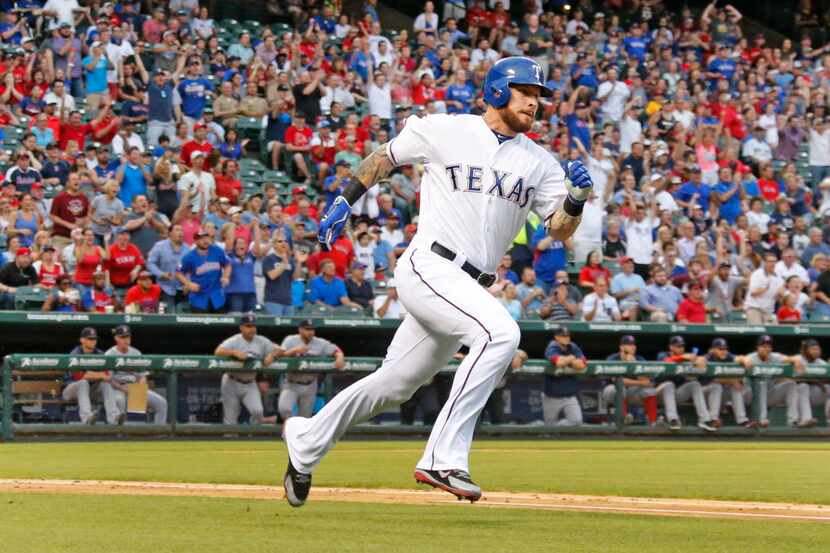 Texas Rangers left fielder Josh Hamilton (32) heads to first base after hitting a second...