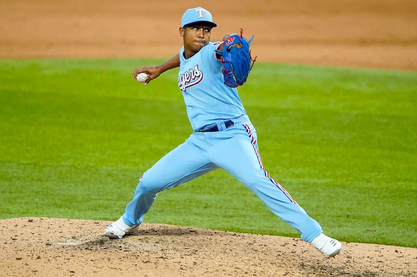 Texas Rangers pitcher Jose Leclerc pitches during the ninth inning against the Colorado...