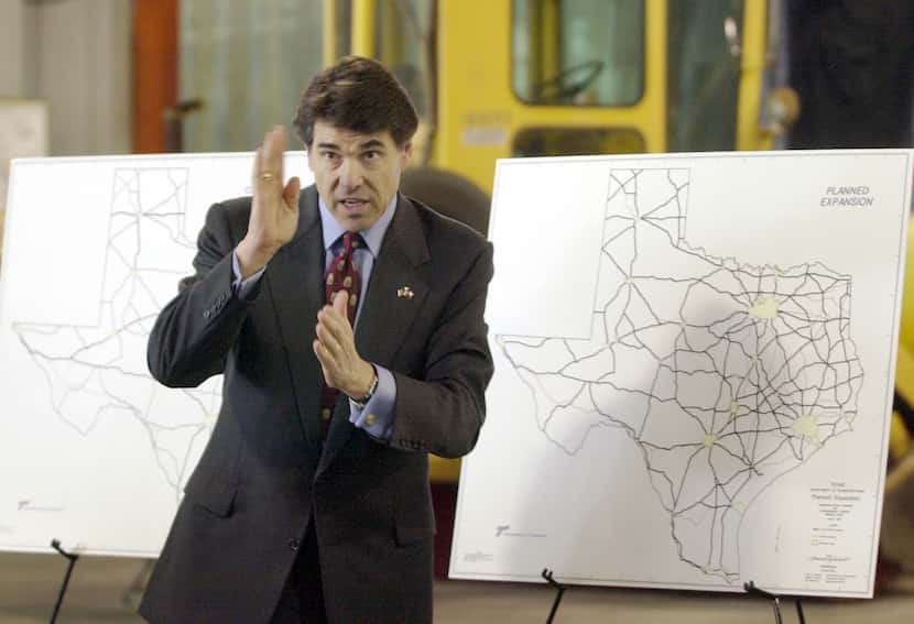 Texas Gov. Rick Perry fields questions about the planned Trans Texas Corridor, while...