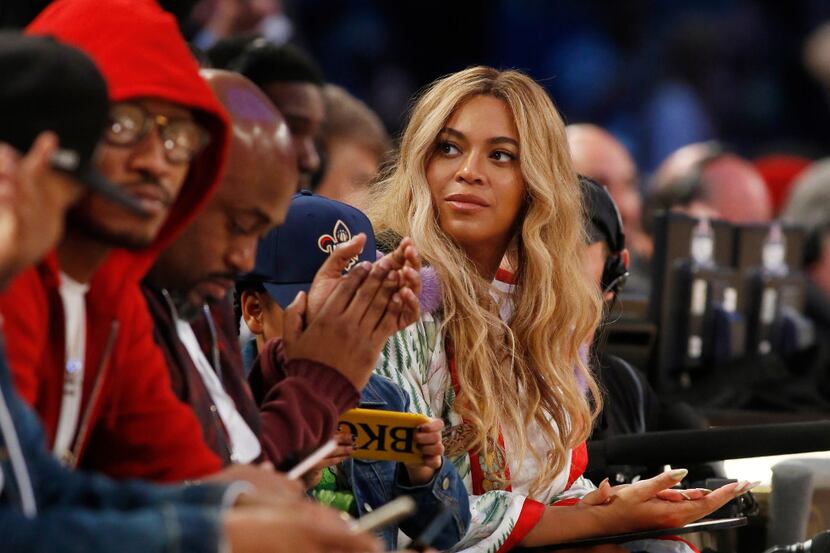 Beyonce sits at court side during the second half of the NBA All-Star basketball game in New...