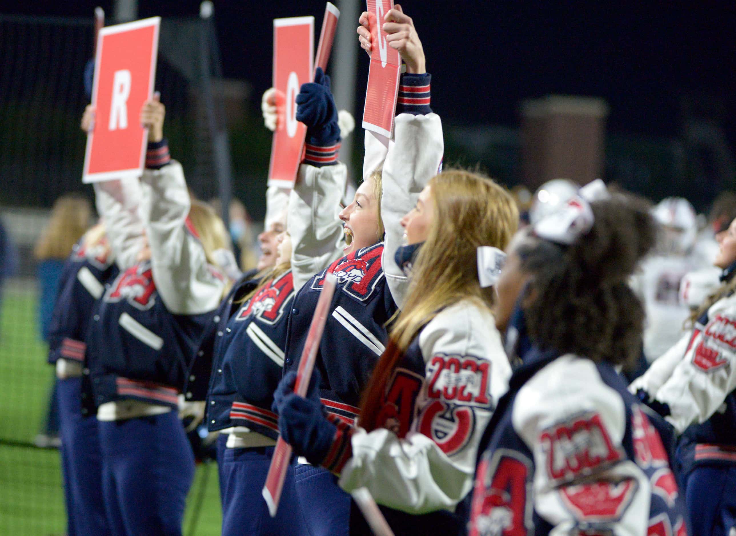 McKinney Boyd cheerleaders perform in the second half of a high school football game between...